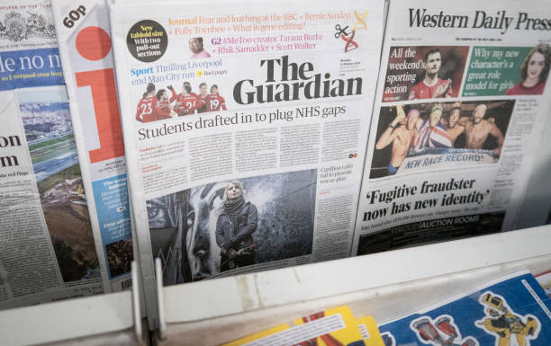 BRISTOL, ENGLAND - JANUARY 15: A copy of the new tabloid sized The Guardian newspaper with its new masthead is pictured for sale on January 15, 2018 in Bristol, England. In a cost-cutting move, publisher Guardian News & Media has ditched the distinctive Berliner size after just over 12 years and outsourced the printing of the tabloid to Trinity Mirror. (Photo by Matt Cardy/Getty Images)