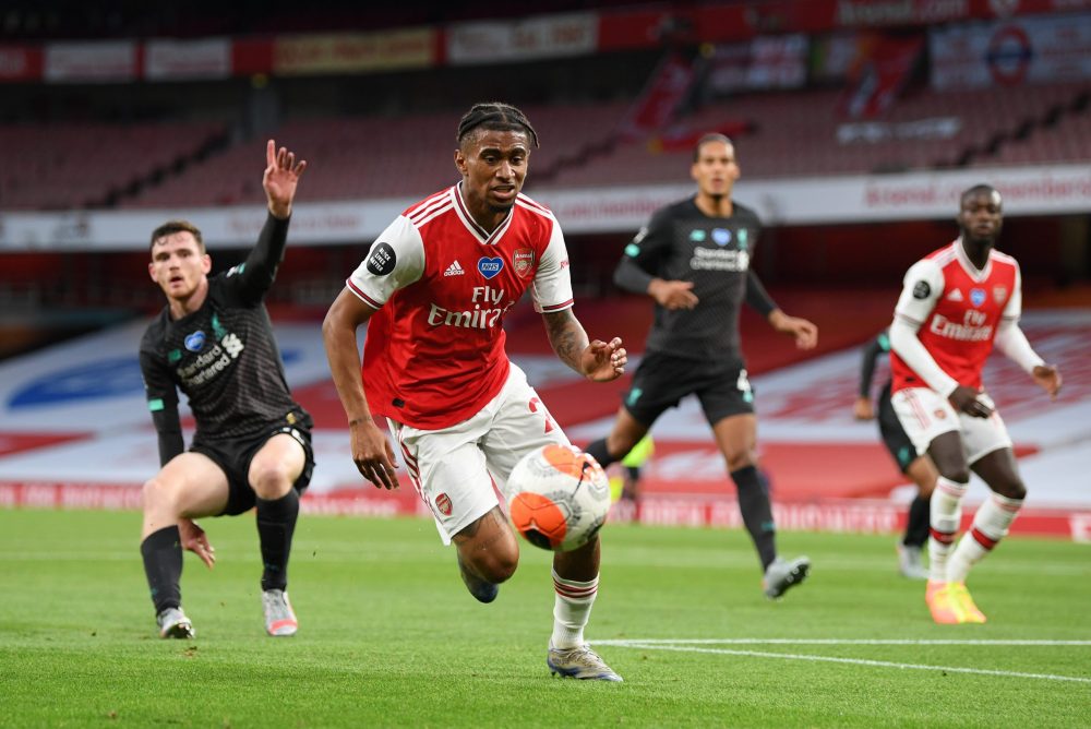 LONDON, ENGLAND - JULY 15:  Reiss Nelson of Arsenal in action during the Premier League match between Arsenal FC and Liverpool FC at Emirates Stadium on July 15, 2020 in London, England. Football Stadiums around Europe remain empty due to the Coronavirus Pandemic as Government social distancing laws prohibit fans inside venues resulting in all fixtures being played behind closed doors. (Photo by Shaun Botterill/Getty Images)