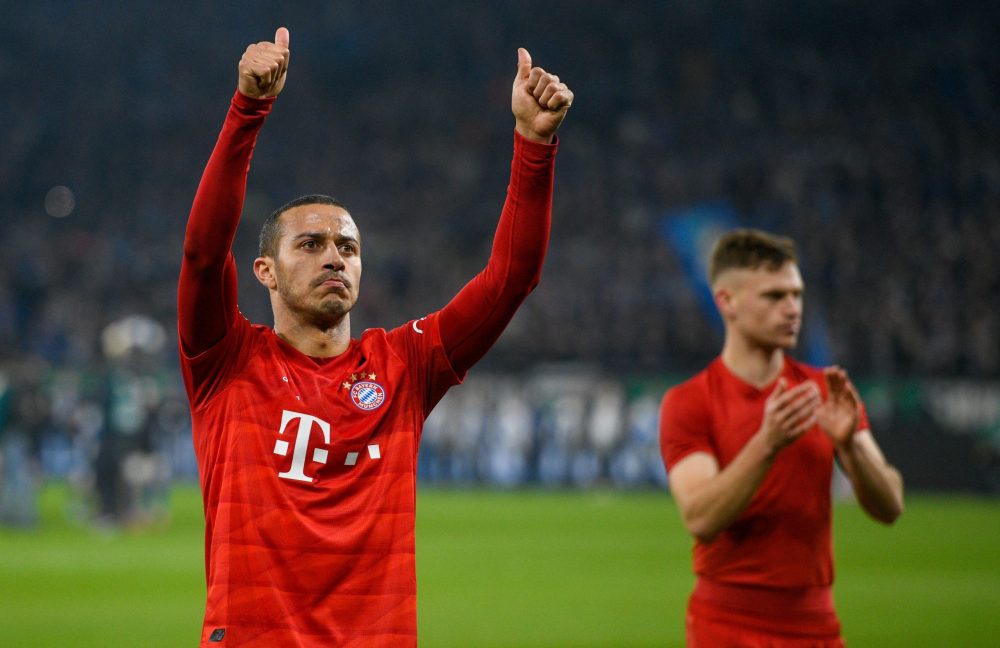 Bayern Munich's Spanish midfielder Thiago Alcantara (L) and Bayern Munich's German midfielder Joshua Kimmich celebrate after the German Cup (DFB Pokal) quarter-final football match Schalke 04 v FC Bayern Munich in Gelsenkirchen, western Germany on March 3, 2020. (Photo by SASCHA SCHUERMANN / AFP) / DFB REGULATIONS PROHIBIT ANY USE OF PHOTOGRAPHS AS IMAGE SEQUENCES AND QUASI-VIDEO. (Photo by SASCHA SCHUERMANN/AFP via Getty Images)