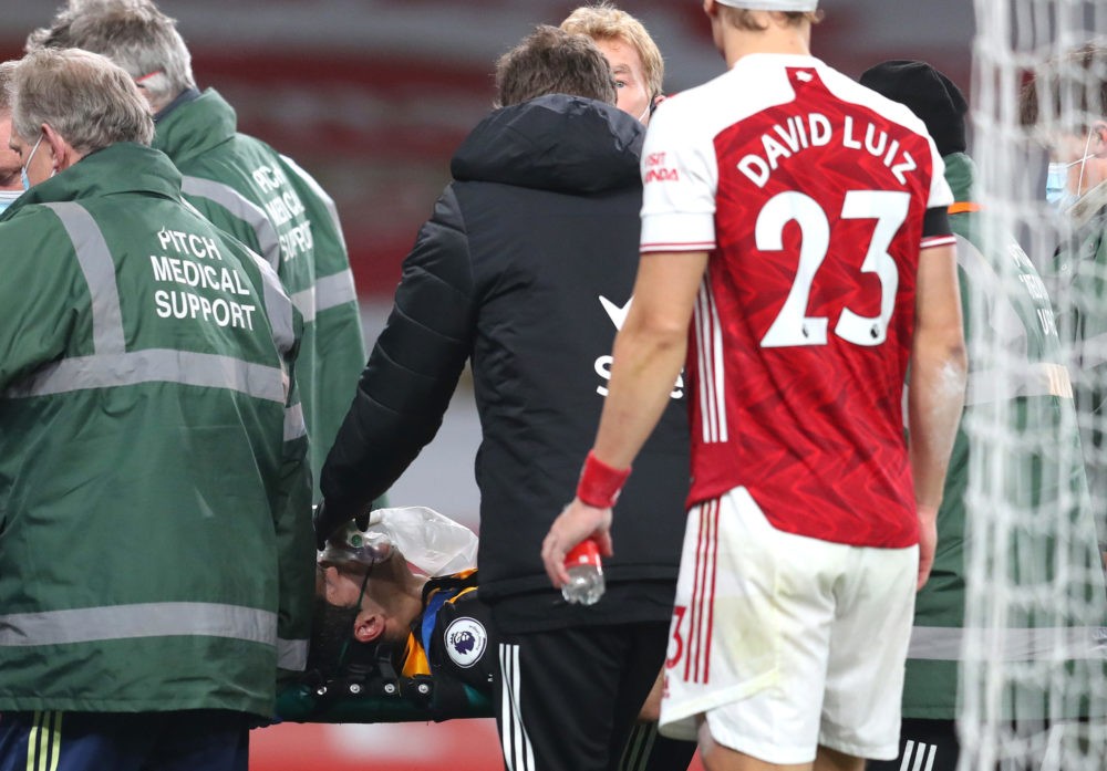 LONDON, ENGLAND - NOVEMBER 29: Raul Jimenez of Wolverhampton Wanderers is stretchered off after colliding with David Luiz of Arsenal during the Premier League match between Arsenal and Wolverhampton Wanderers at Emirates Stadium on November 29, 2020 in London, England. Sporting stadiums around the UK remain under strict restrictions due to the Coronavirus Pandemic as Government social distancing laws prohibit fans inside venues resulting in games being played behind closed doors. (Photo by Catherine Ivill/Getty Images)